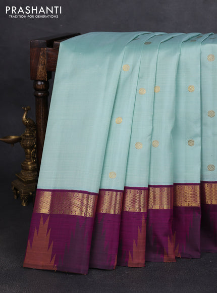 Pure kanchipuram silk saree pastel blue shade and purple with zari woven buttas and rich zari woven temple design border border