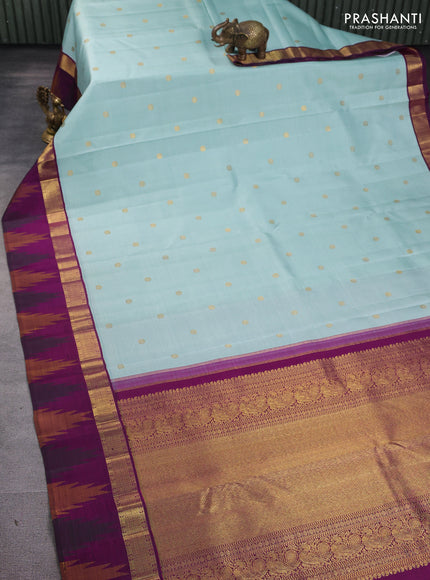 Pure kanchipuram silk saree pastel blue shade and purple with zari woven buttas and rich zari woven temple design border border