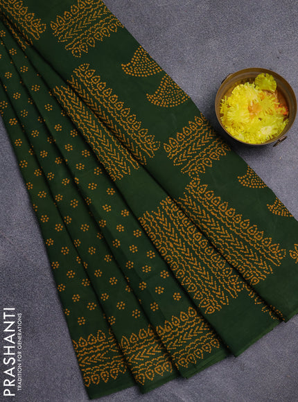 Sungudi cotton saree green with allover butta prints and printed border