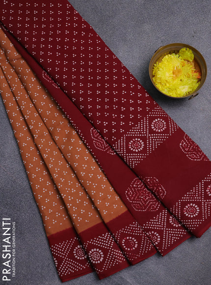 Sungudi cotton saree dark sandal and sandal with allover butta prints and printed border