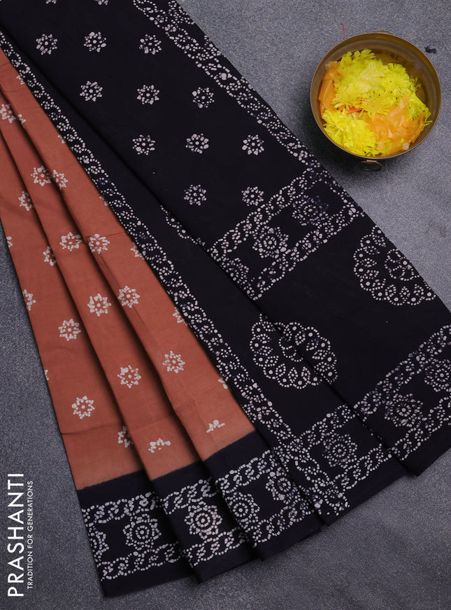 Sungudi cotton saree brown and navy blue with allover batik prints and printed border