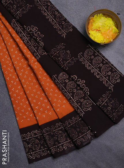 Sungudi cotton saree dark mustard and coffee brown with allover butta prints and paisley printed border