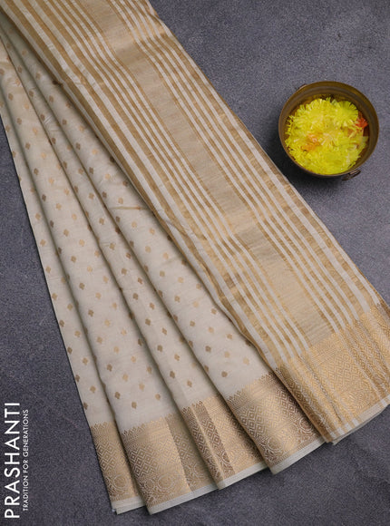Semi raw silk saree cream with allover zari woven 1000 buttas and zari woven border