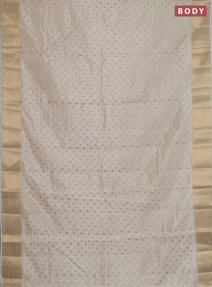Semi raw silk saree cream with allover zari woven 1000 buttas and zari woven border
