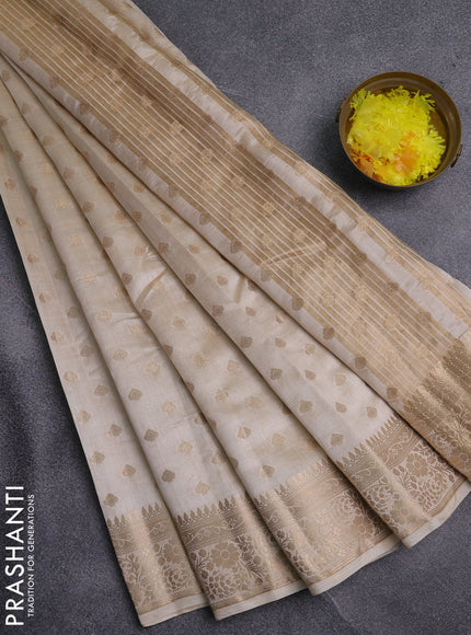 Semi raw silk saree cream with allover zari woven 1000 buttas and zari woven border