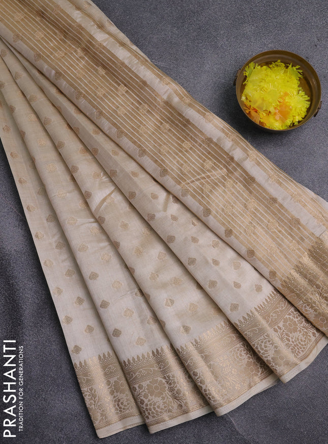 Semi raw silk saree cream with allover zari woven 1000 buttas and zari woven border
