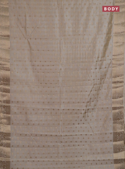 Semi raw silk saree cream with allover zari woven 1000 buttas and zari woven border