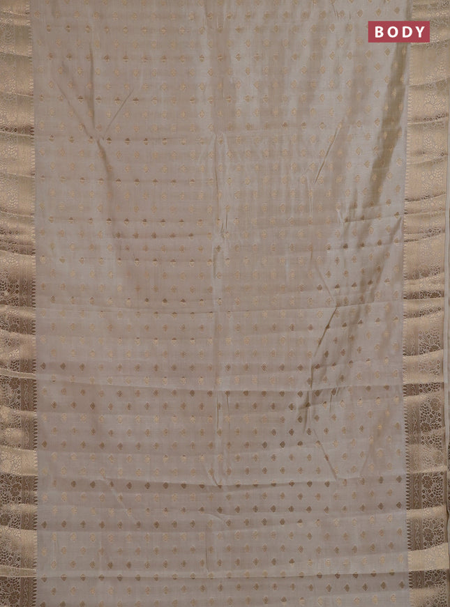 Semi raw silk saree cream with allover zari woven 1000 buttas and zari woven border