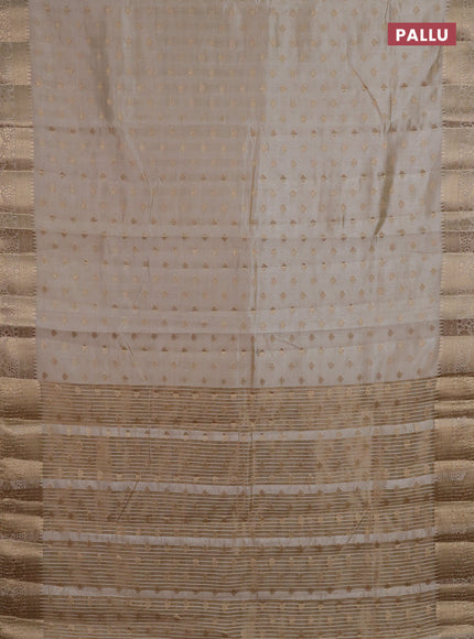 Semi raw silk saree cream with allover zari woven 1000 buttas and zari woven border