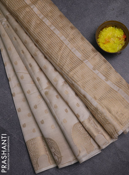 Semi raw silk saree cream with allover zari woven 1000 buttas and zari woven border