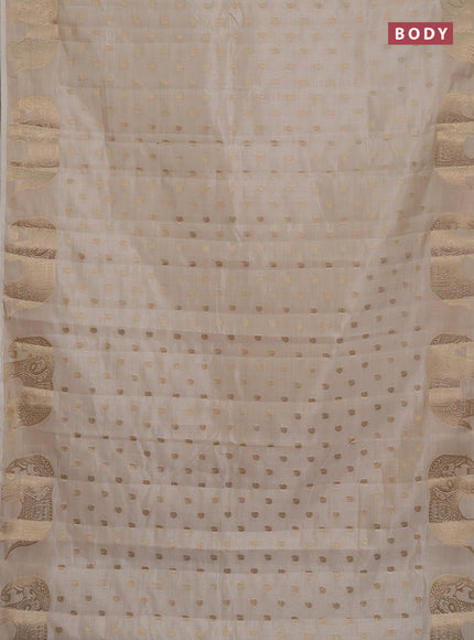 Semi raw silk saree cream with allover zari woven 1000 buttas and zari woven border