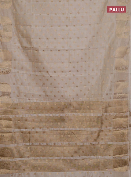 Semi raw silk saree cream with allover zari woven 1000 buttas and zari woven border