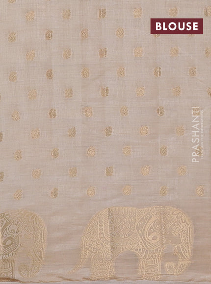 Semi raw silk saree cream with allover zari woven 1000 buttas and zari woven border