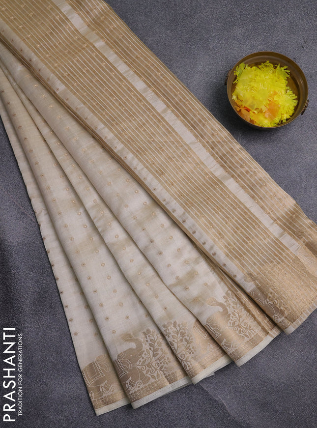 Semi raw silk saree cream with allover zari woven 1000 buttas and zari woven border