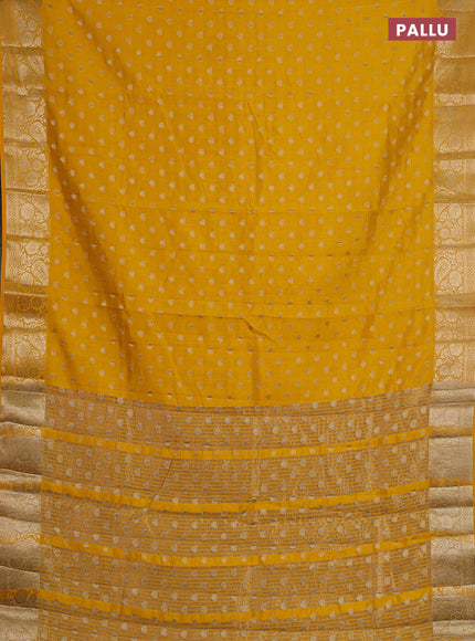 Semi raw silk saree yellow with allover zari woven 1000 buttas and zari woven border