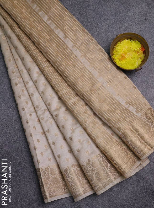 Semi raw silk saree cream with allover zari woven 1000 buttas and zari woven border
