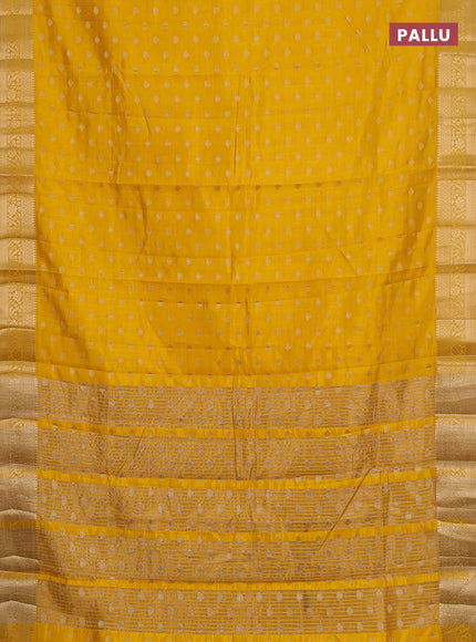 Semi raw silk saree yellow with allover zari woven 1000 buttas and zari woven border