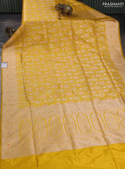Banarasi uppada silk saree yellow with allover zari woven brocade weaves and floral zari woven border