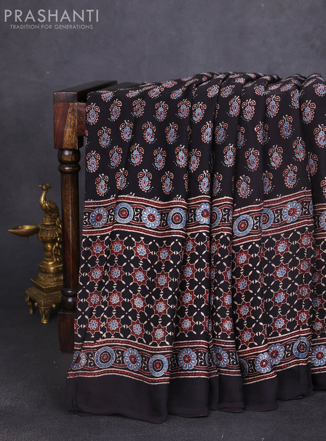 Modal silk saree black with allover ajrakh butta prints and printed border