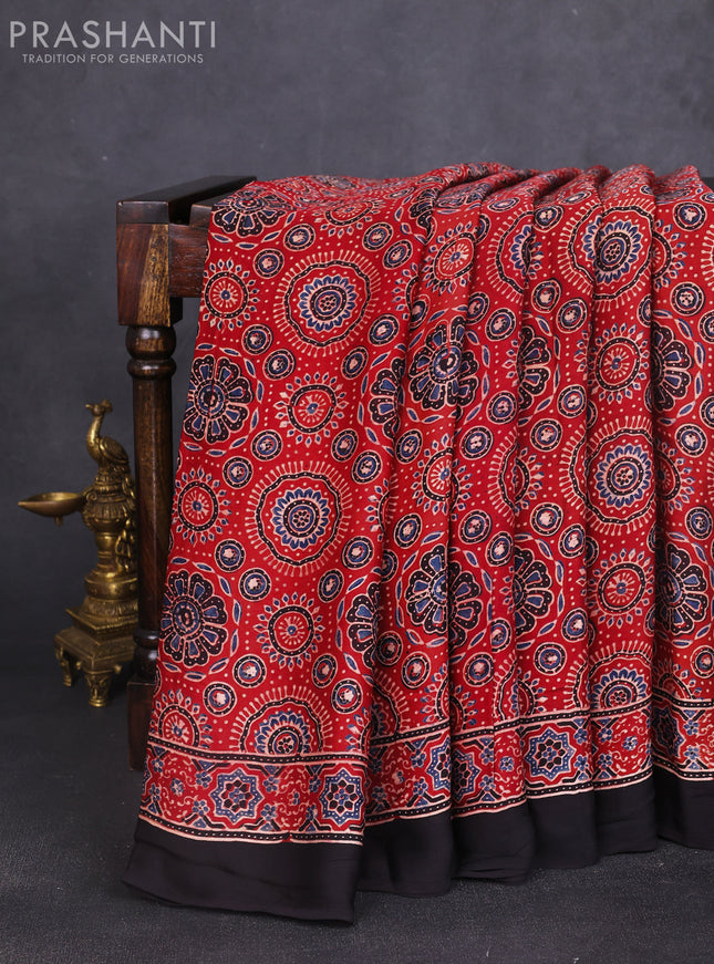 Modal silk saree rustic maroon and black with allover ajrakh prints and printed border