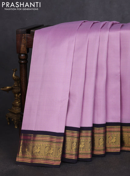 Pure kanchipuram silk saree mild lavender and navy blue with allover smalk zari woven checked pattern and zari woven korvai border