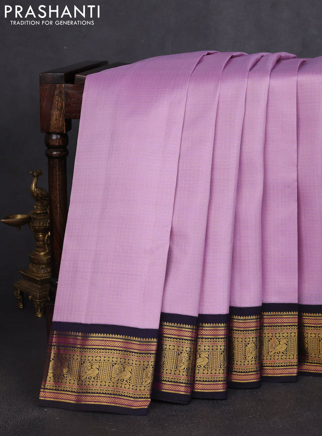 Pure kanchipuram silk saree mild lavender and navy blue with allover smalk zari woven checked pattern and zari woven korvai border