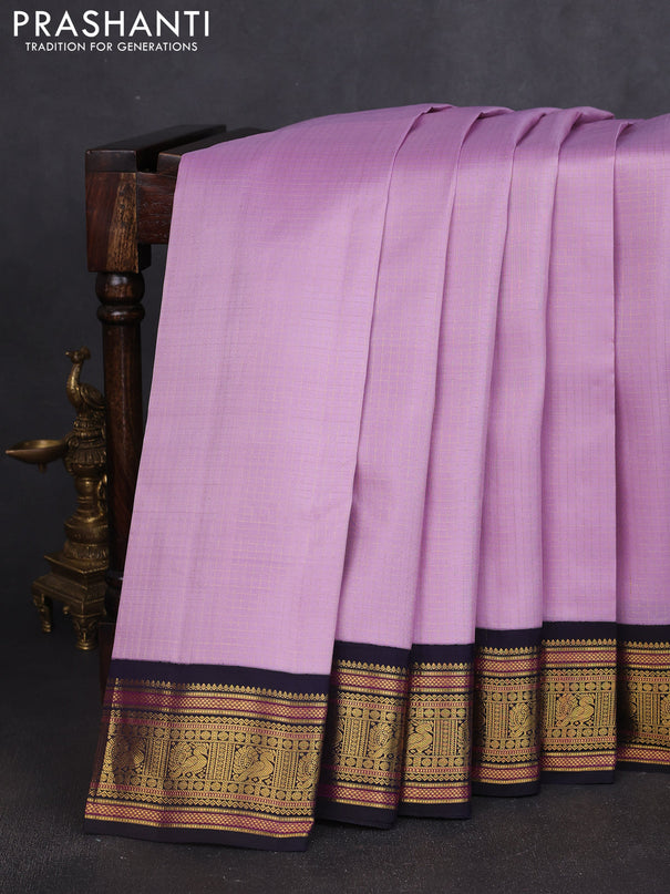 Pure kanchipuram silk saree mild lavender and navy blue with allover smalk zari woven checked pattern and zari woven korvai border