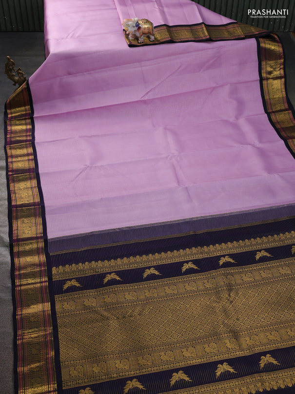 Pure kanchipuram silk saree mild lavender and navy blue with allover smalk zari woven checked pattern and zari woven korvai border