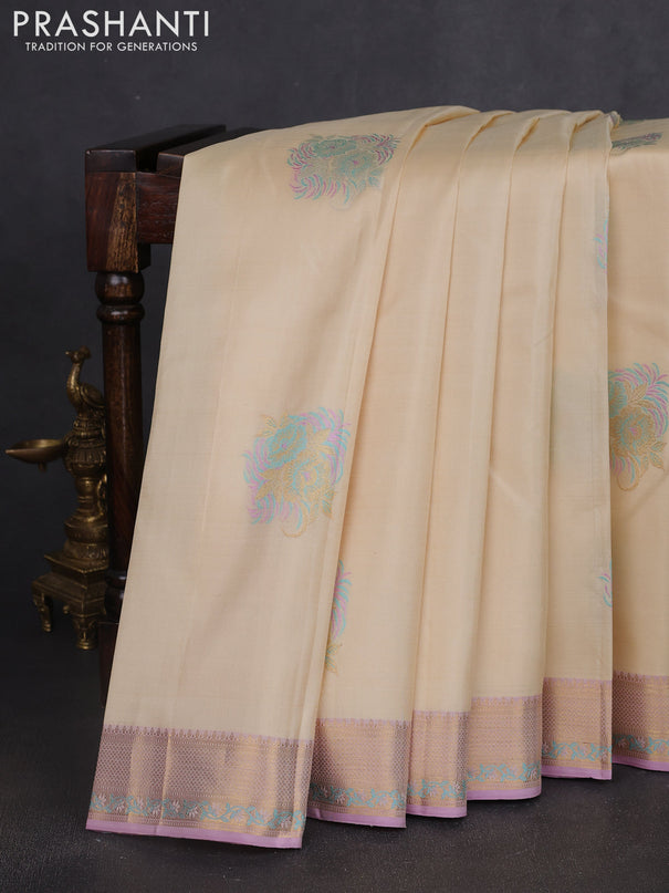 Pure kanchipuram silk saree cream and mild lavender with thread & zari woven floral buttas and rich zari woven border