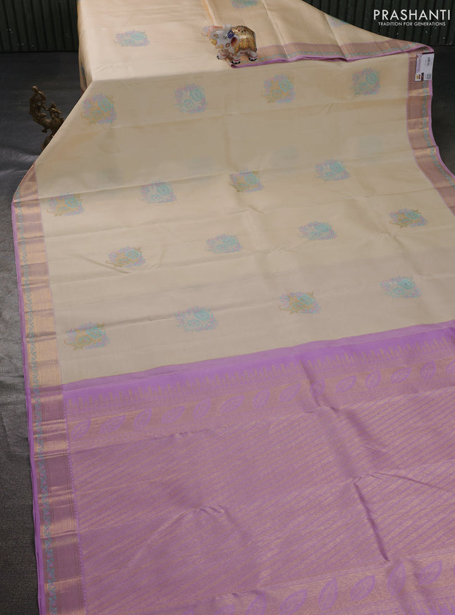 Pure kanchipuram silk saree cream and mild lavender with thread & zari woven floral buttas and rich zari woven border