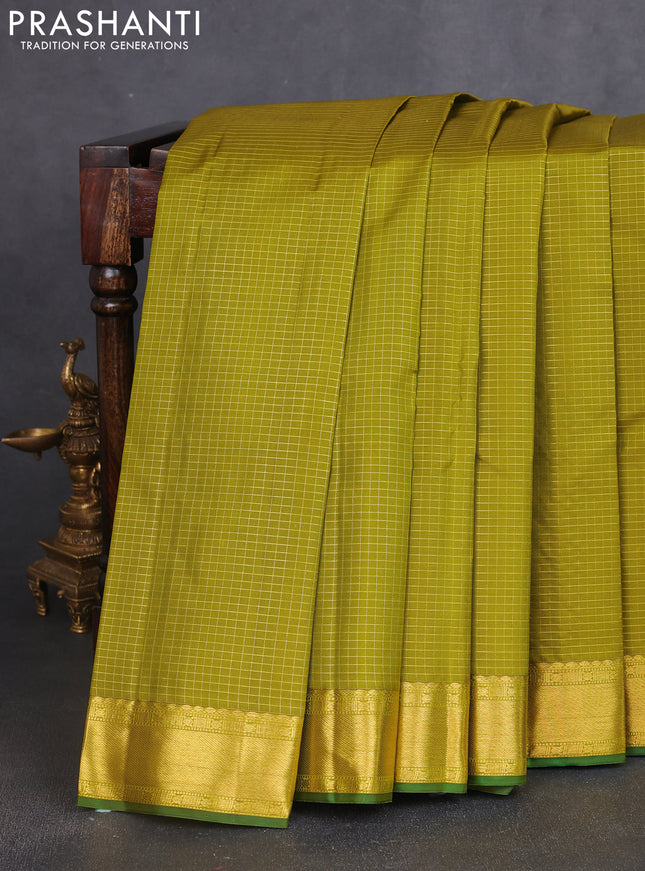 Pure kanchipuram silk saree mehendi green and green with allover zari checked pattern and zari woven border