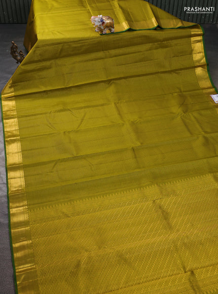 Pure kanchipuram silk saree mehendi green and green with allover zari checked pattern and zari woven border