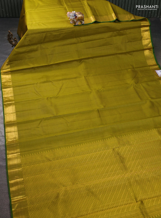Pure kanchipuram silk saree mehendi green and green with allover zari checked pattern and zari woven border