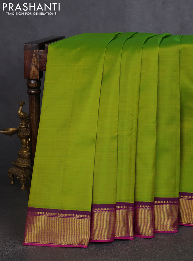 Pure kanchipuram silk saree light green and purple with plain body and zari woven border
