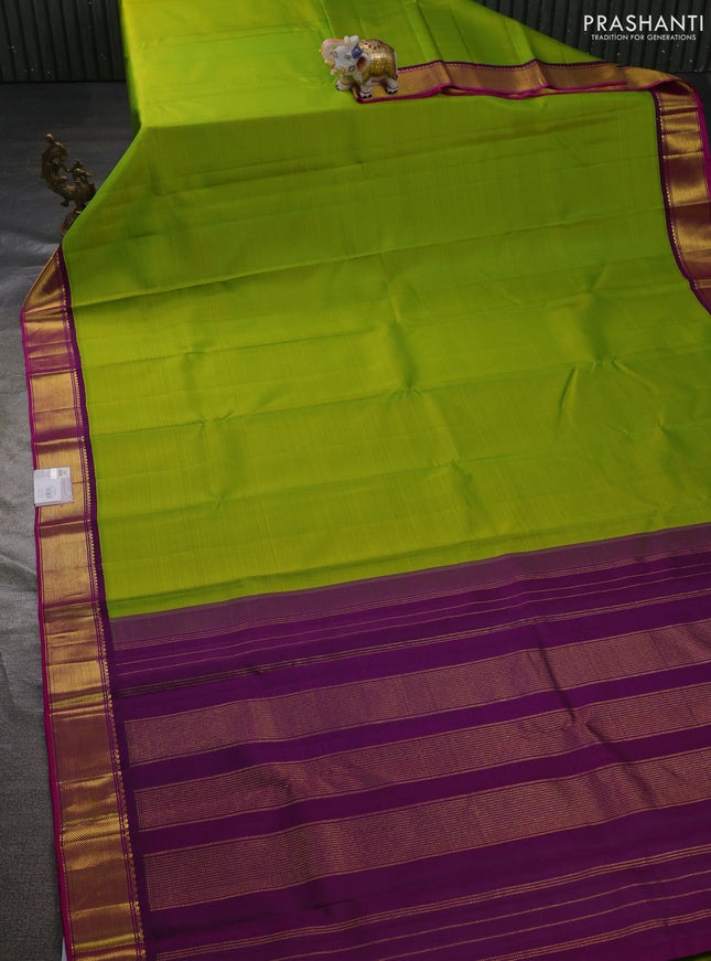 Pure kanchipuram silk saree light green and purple with plain body and zari woven border