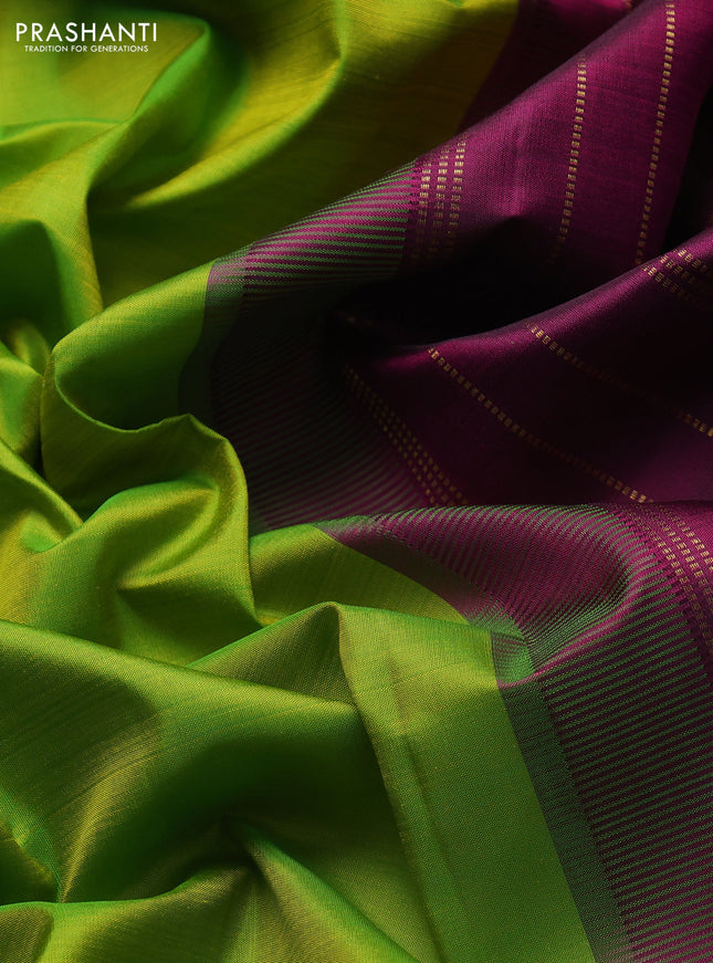 Pure kanchipuram silk saree light green and purple with plain body and zari woven border