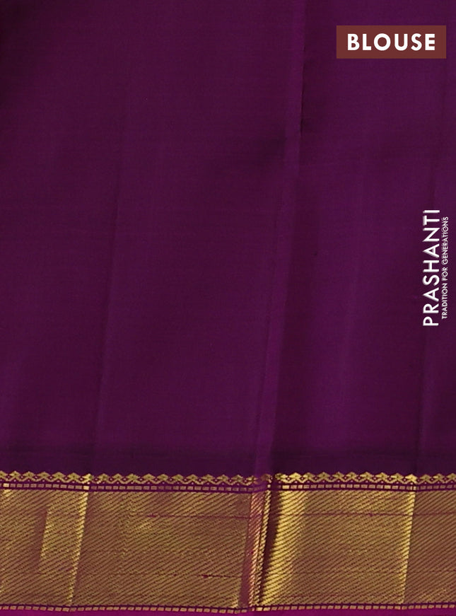 Pure kanchipuram silk saree light green and purple with plain body and zari woven border