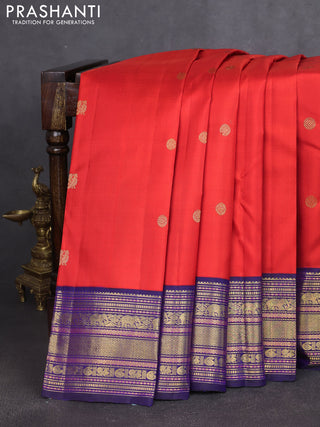 Pure kanchipuram silk saree reddish orange and blue with annam & rudhraksha zari woven buttas and rich zari woven korvai border