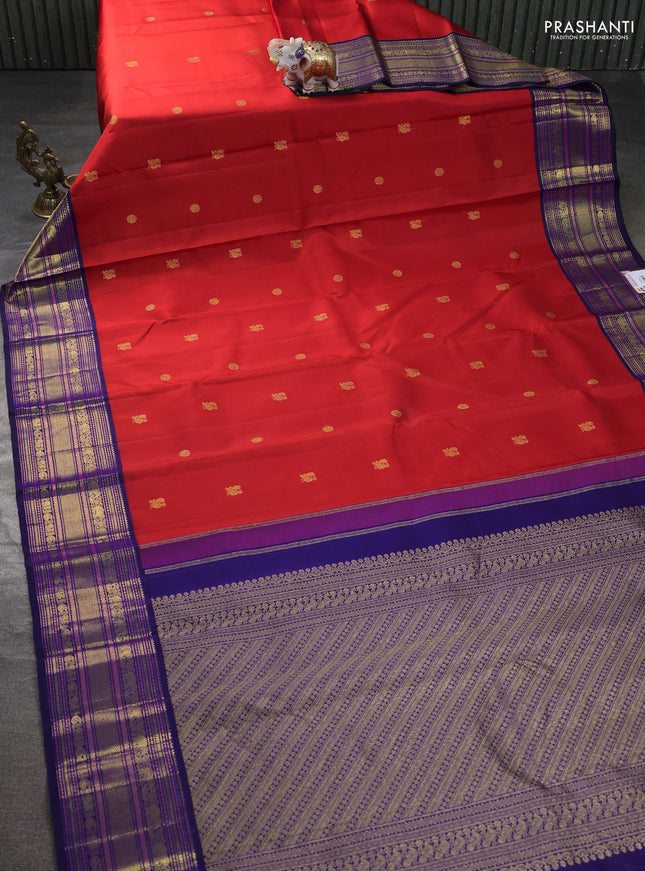 Pure kanchipuram silk saree reddish orange and blue with annam & rudhraksha zari woven buttas and rich zari woven korvai border