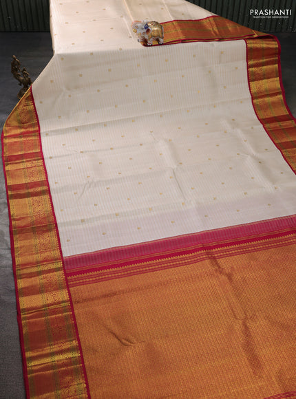 Pure kanchipuram silk saree cream and dark pink with zari woven buttas and rich zari woven korvai border