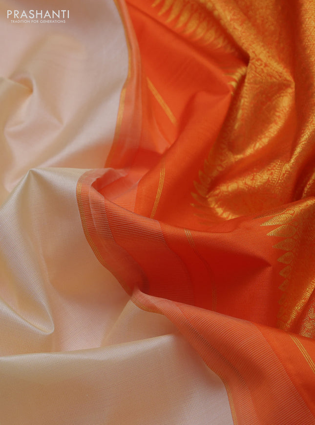 Pure kanchipuram silk saree cream and orange with zari woven buttas and rich zari woven korvai border