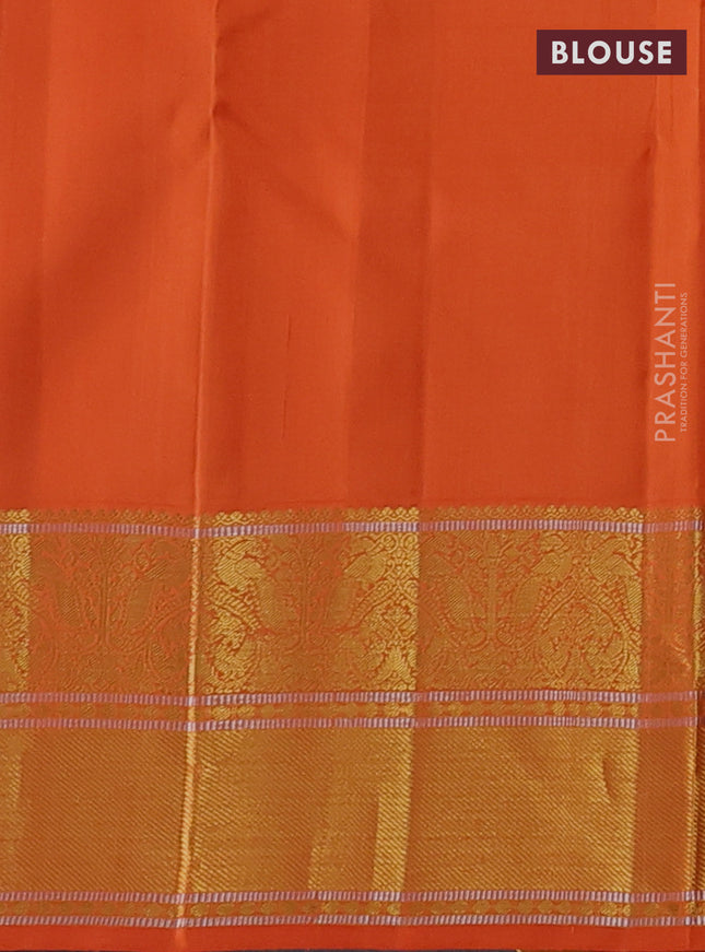 Pure kanchipuram silk saree cream and orange with zari woven buttas and rich zari woven korvai border