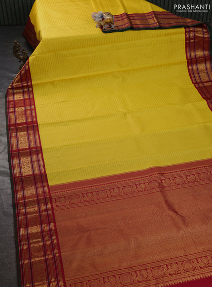 Pure kanchipuram silk saree yellow and maroon green with allover zari stripe weaves and zari woven korvai border