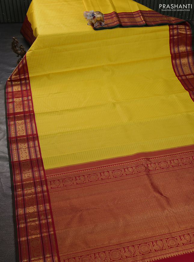 Pure kanchipuram silk saree yellow and maroon green with allover zari stripe weaves and zari woven korvai border