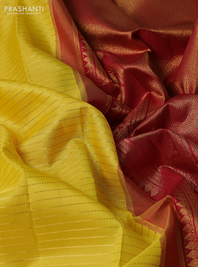 Pure kanchipuram silk saree yellow and maroon green with allover zari stripe weaves and zari woven korvai border