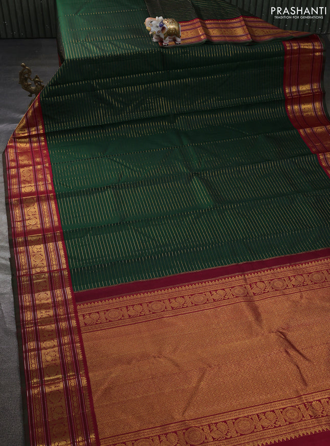 Pure kanchipuram silk saree green and maroon with allover zari stripe weaves and zari woven korvai border