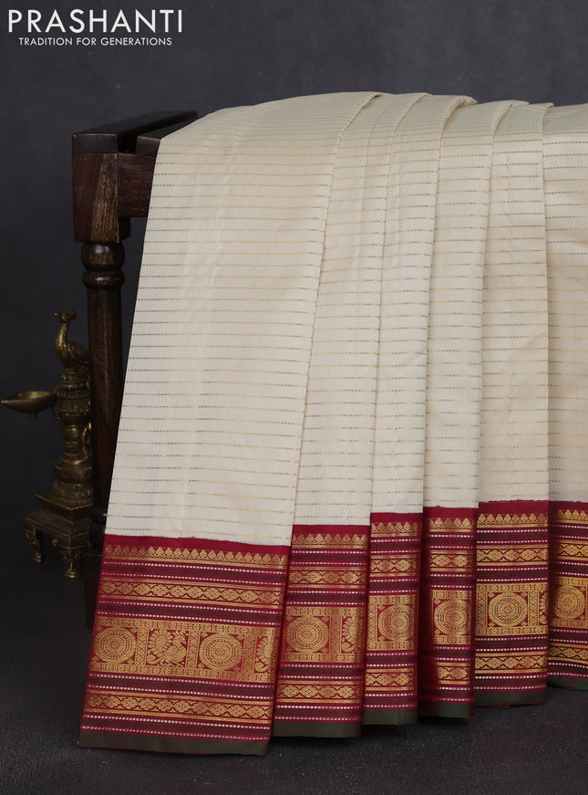 Pure kanchipuram silk saree cream and maroon with allover zari stripe weaves and zari woven korvai border