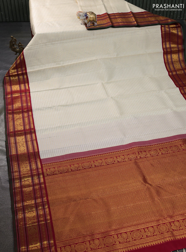 Pure kanchipuram silk saree cream and maroon with allover zari stripe weaves and zari woven korvai border