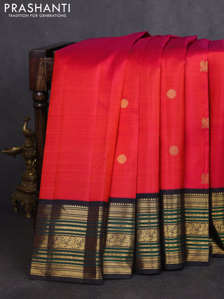 Pure kanchipuram silk saree dual shade of pinkish orange and black with annam & rudhraksha zari woven buttas and rich zari woven border