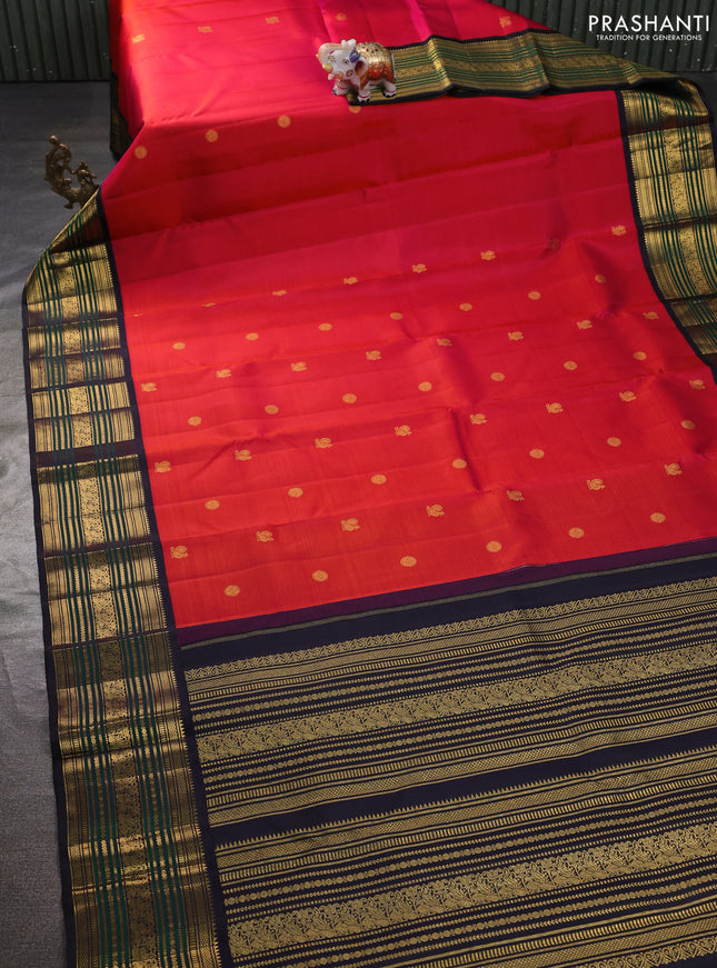 Pure kanchipuram silk saree dual shade of pinkish orange and black with annam & rudhraksha zari woven buttas and rich zari woven border